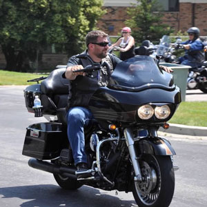 Bill Lathouris, one of the founding members of Out of the Darkness Bike Run, rides in support of suicide prevention