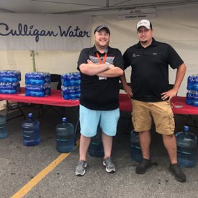 Staff at Culligan of North West Arkansas provide water at the Bentonville Tour de Cure